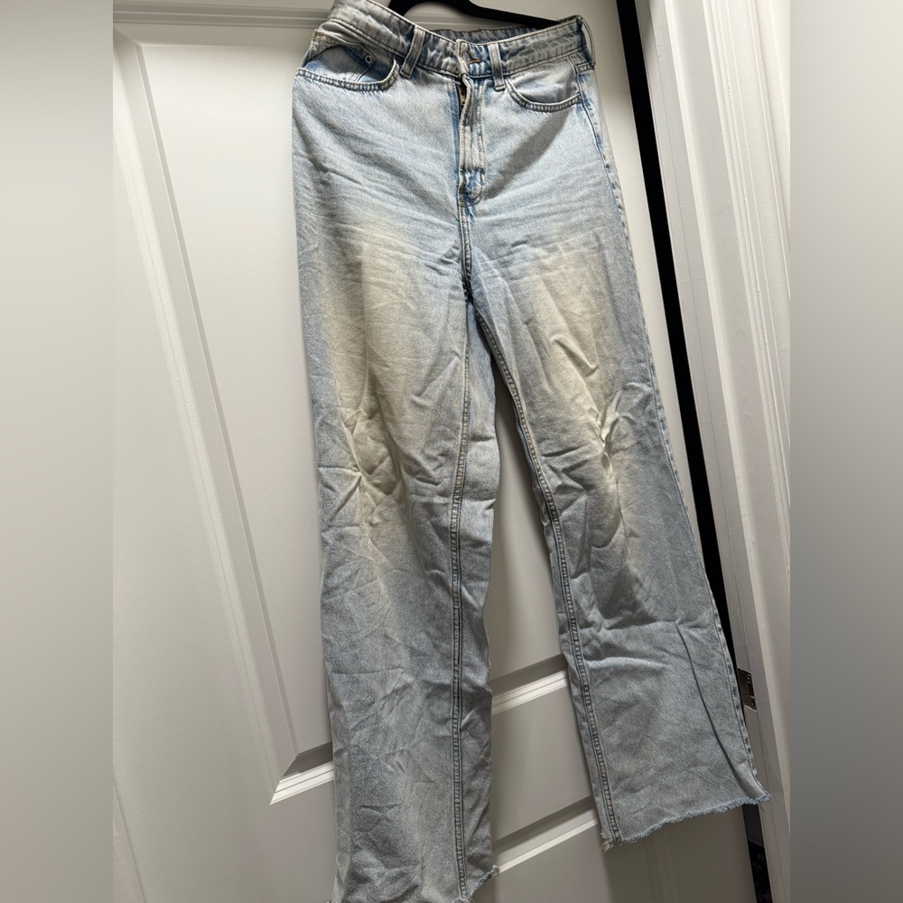 Women’s size 6 high waisted and wide leg pair of jeans